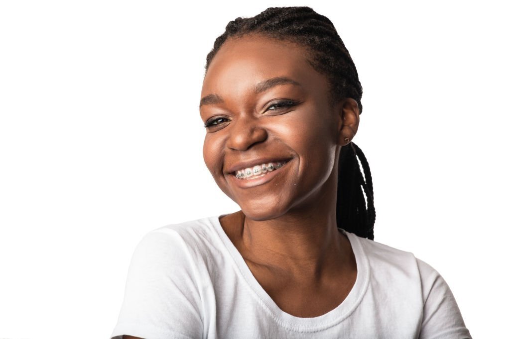 black woman smiling with braces