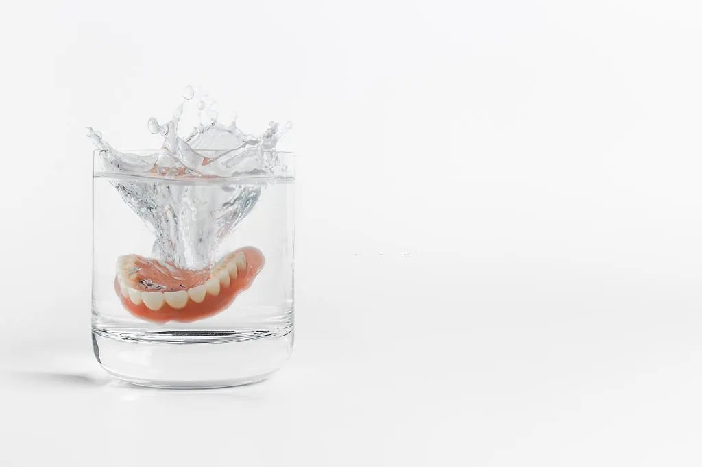 Dentures on a glass of water