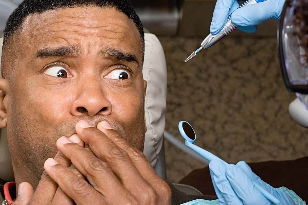 Man looking scared at the dentist