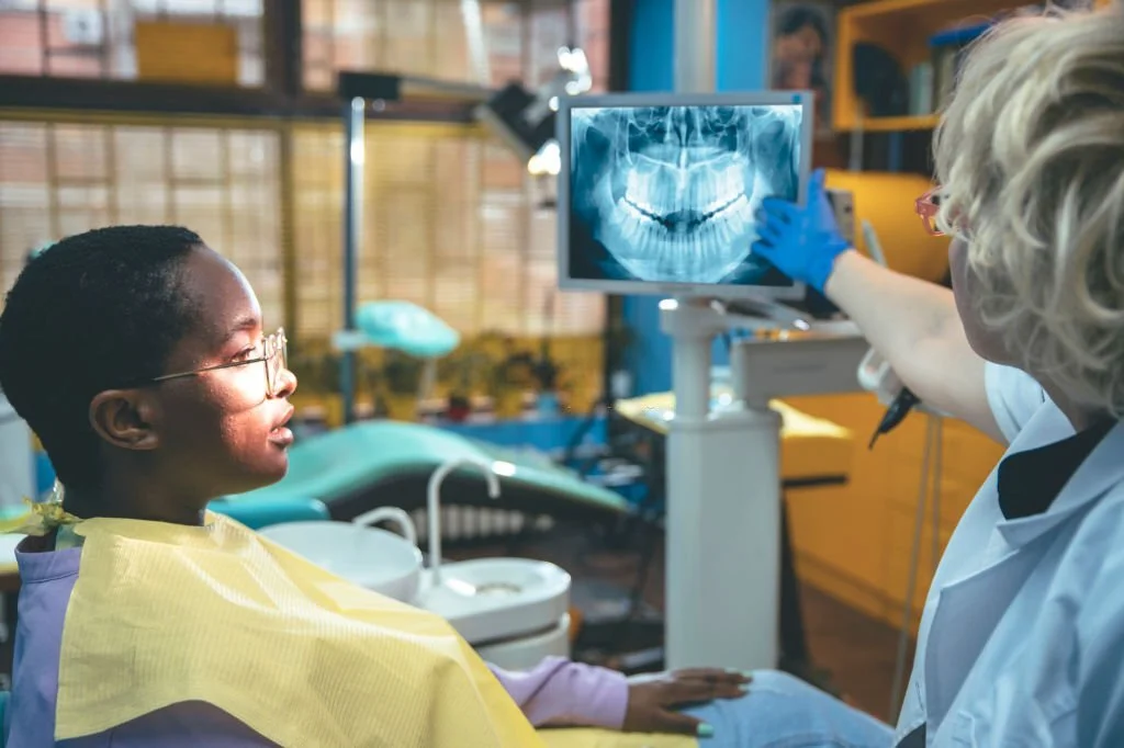 Dentist showing a patient their X-rays