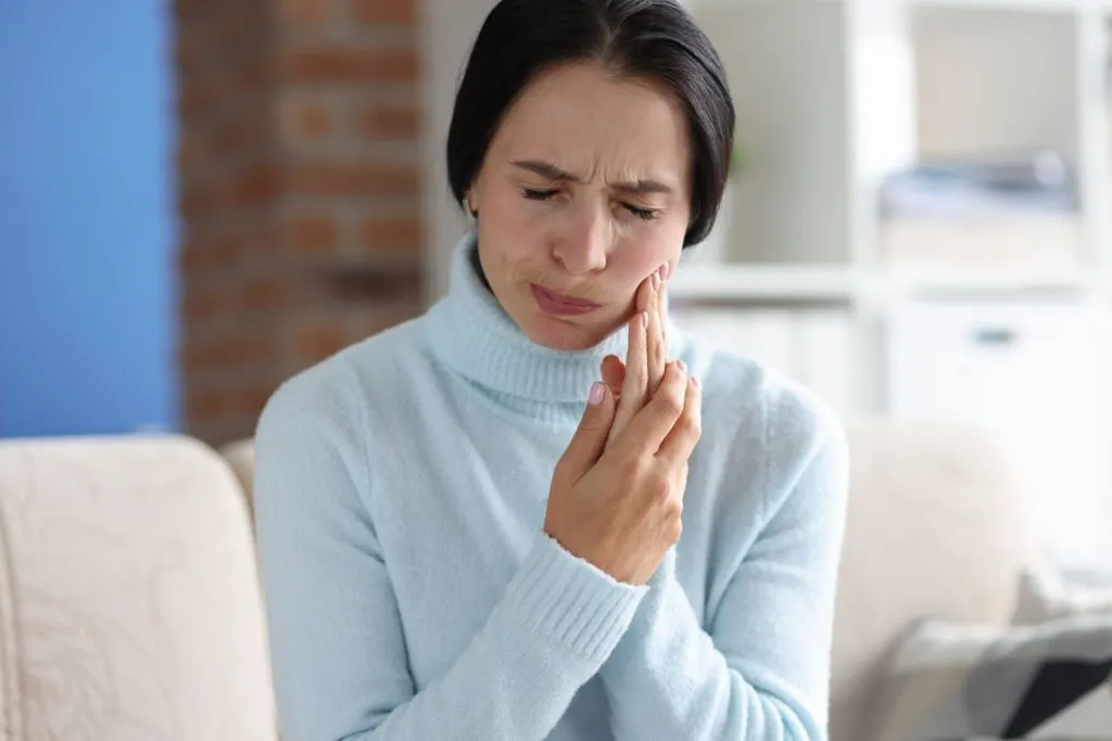 Woman having a tooth ache