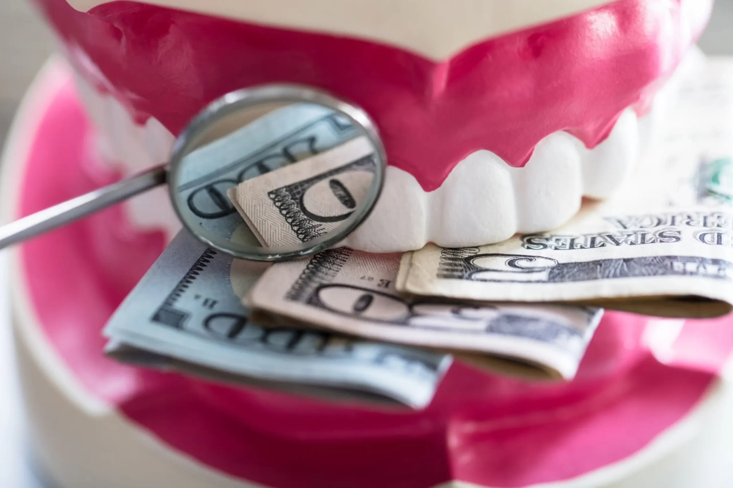 Teeth prop biting on money